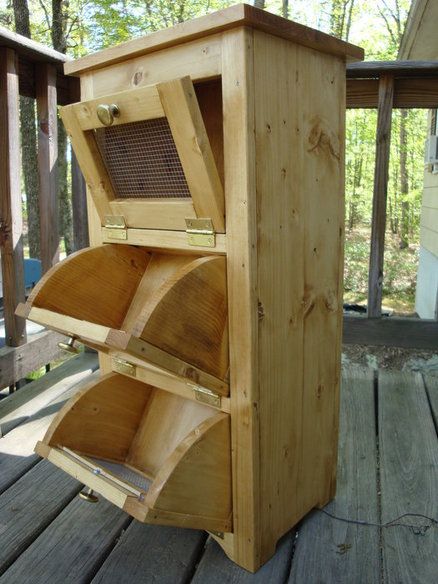 a wooden stove sitting on top of a wooden deck