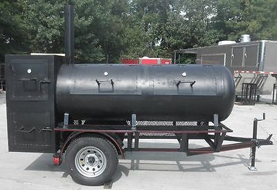 a large black tank sitting on the back of a trailer