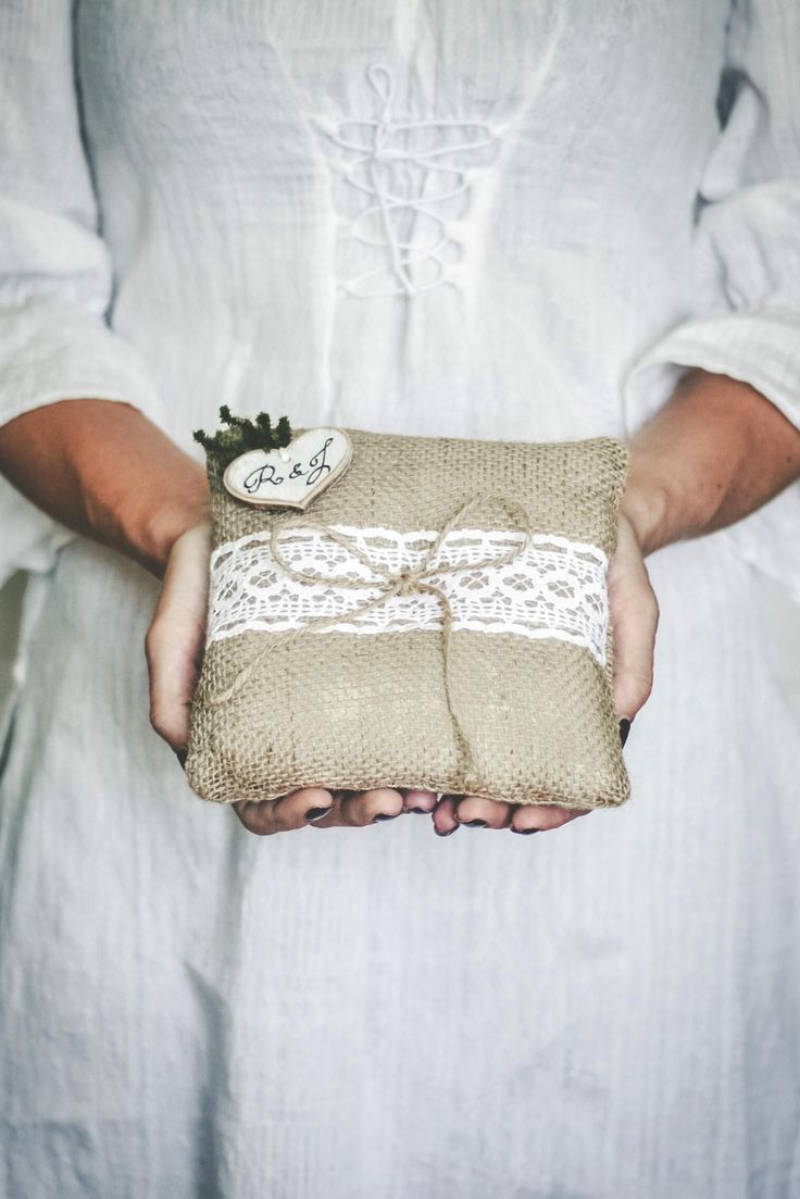 a person holding a small bag in their hands