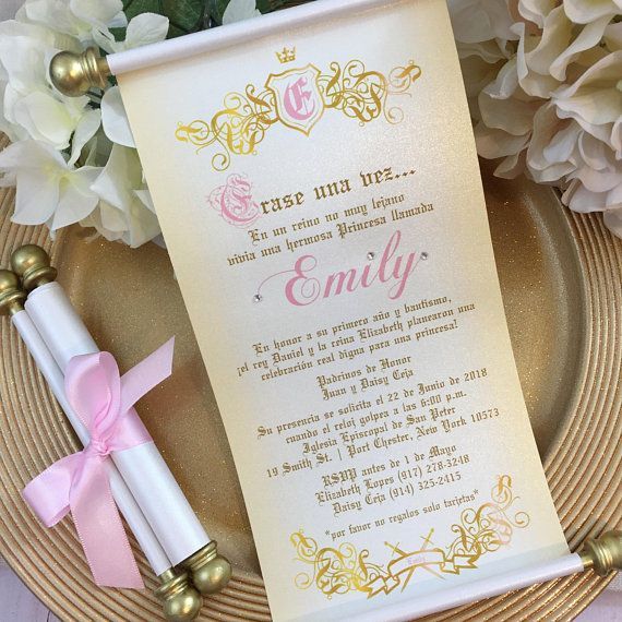 a pink and gold wedding ceremony program on a plate with flowers in the back ground