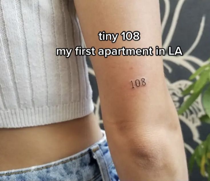 a woman's arm with the words tiny 103 my first apartment in la on it