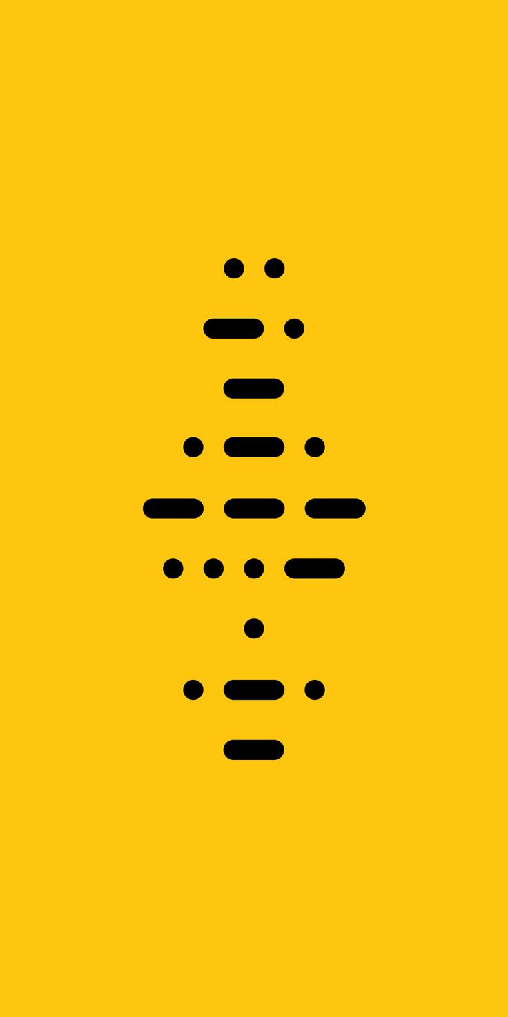 a yellow background with black dots on it