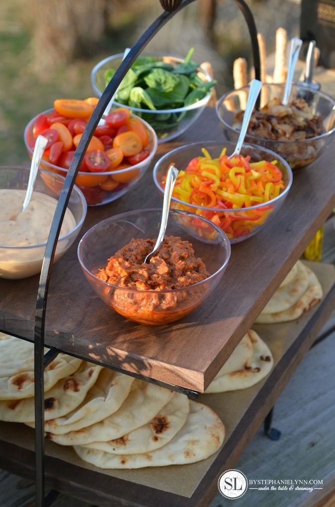 a wooden table topped with lots of food