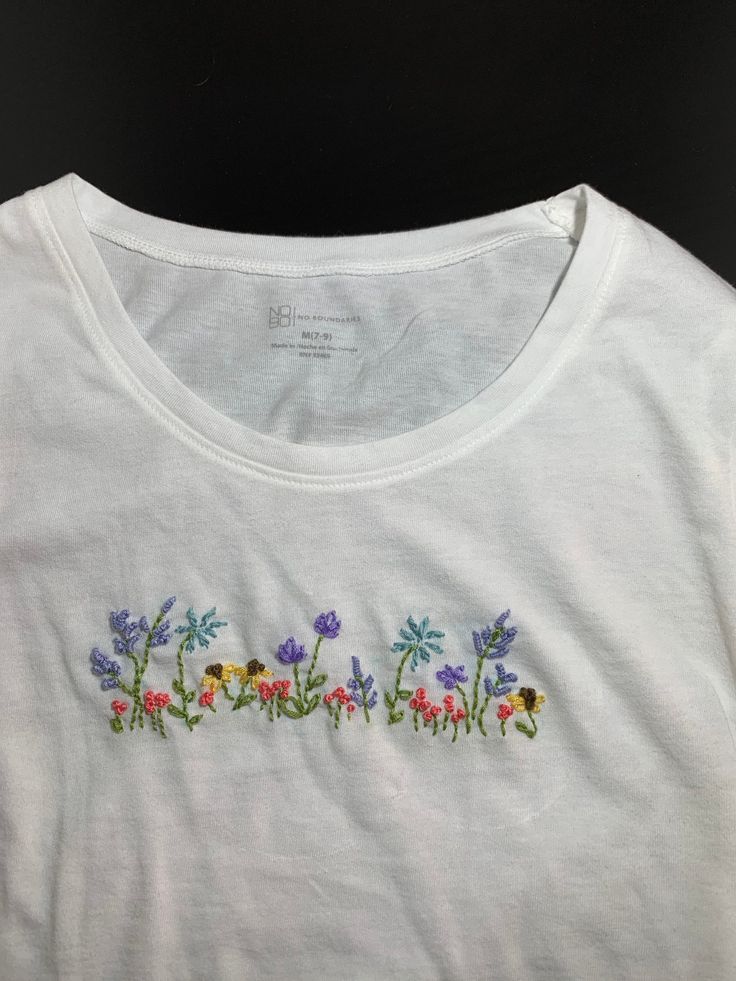 White Casual Top With Custom Embroidery, Long Sleeve Cotton Tops With Machine Embroidery, White Casual Tops With Custom Embroidery, Cotton Long Sleeve Tops With Machine Embroidery, Spring Cotton Tops With Floral Embroidery, Spring Crew Neck Top With Embroidered Graphics, Embroidered Cotton Tops For Spring, Cotton Tops With Floral Embroidery For Spring, Casual Cotton Tops With Floral Embroidery