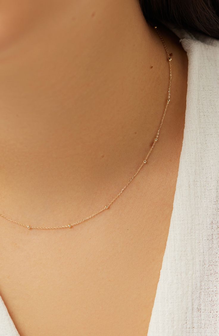 So minimal and made to last a lifetime, this dainty gold necklace is soon to be the start of your new favorite stack. Crafted from waterproof recycled solid gold, this simple gold necklace puts a luxe finishing touch on every look. 10k recycled solid gold Designed to last a lifetime Dainty silhouette Length: 406mm - 16", 51mm - 2" Weight: 1g Chain Width:1.8mm - 0.07" Spring Ring Clasp Crafted In China Satellite Necklace, Simple Gold Necklace, Plain Jewelry, Gold Necklace Wedding, Dainty Chain Necklace, Solid Gold Charms, Gold Necklace Simple, Basic Jewelry, Bracelets Gold Diamond