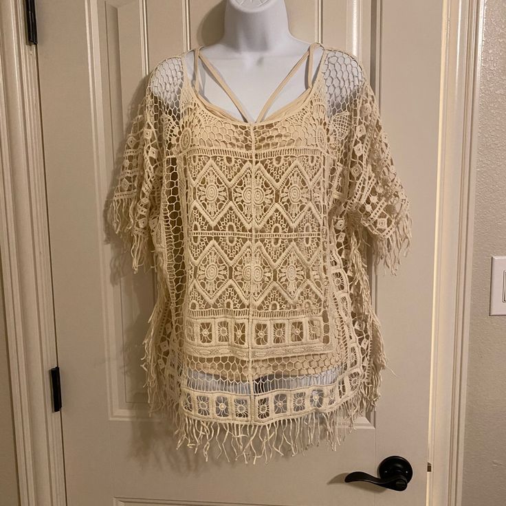 Crochet Fringe Poncho Pure White Open Knit Poncho For Vacation, Casual Summer Poncho With Fringe, Open Knit Summer Beach Poncho, Summer Beach Open Knit Poncho, Cream Top For Spring Beach Cover-up, Beige Crochet Top For Fall Vacation, Bohemian Open Knit Poncho For Beach, Bohemian Open Knit Beach Poncho, One Size Open Knit Poncho For Summer