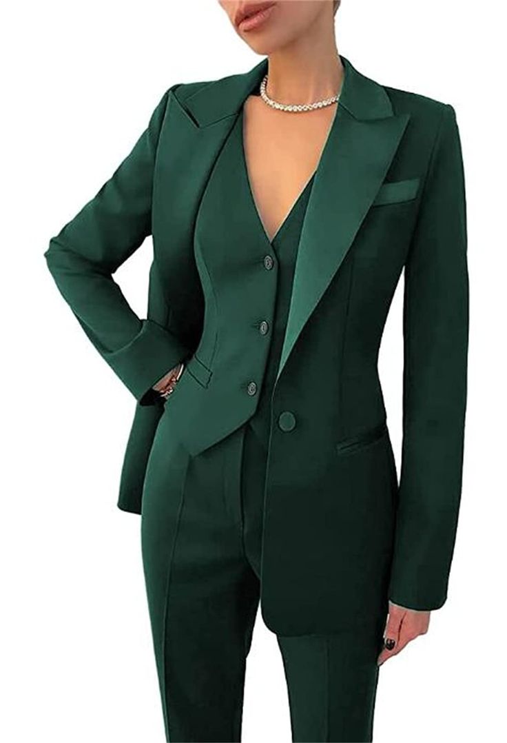 a woman wearing a green suit and pearls