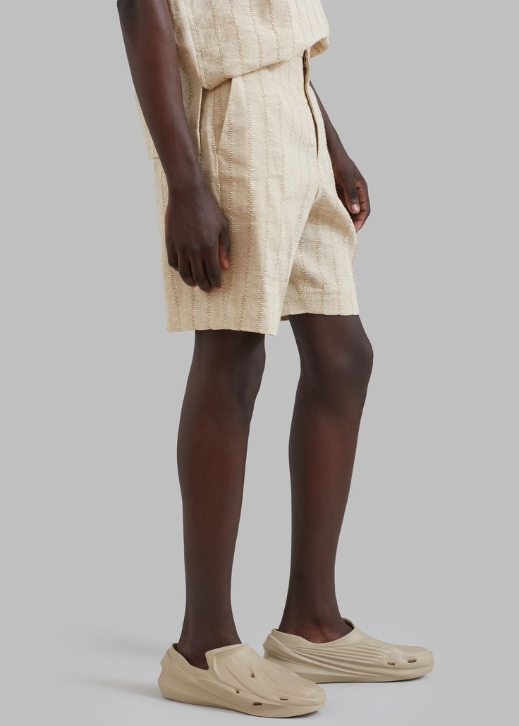 Color: Straw Woven linen-cotton blend fabric Relaxed fit High rise Striped pattern Slant hip pockets Hook and bar closure Zip fly Unlined 63% Linen 37% Cotton Dry Clean Only By Róhe. Made in Lithuania Luxury Relaxed Fit Linen Shorts, Luxury Linen High-waisted Shorts, Beige Linen Bottoms With Built-in Shorts, Beige High-waist Cotton Shorts, High-waisted Linen Shorts For Loungewear, Linen Shorts, Stripes Pattern, Straw, Cotton Blend