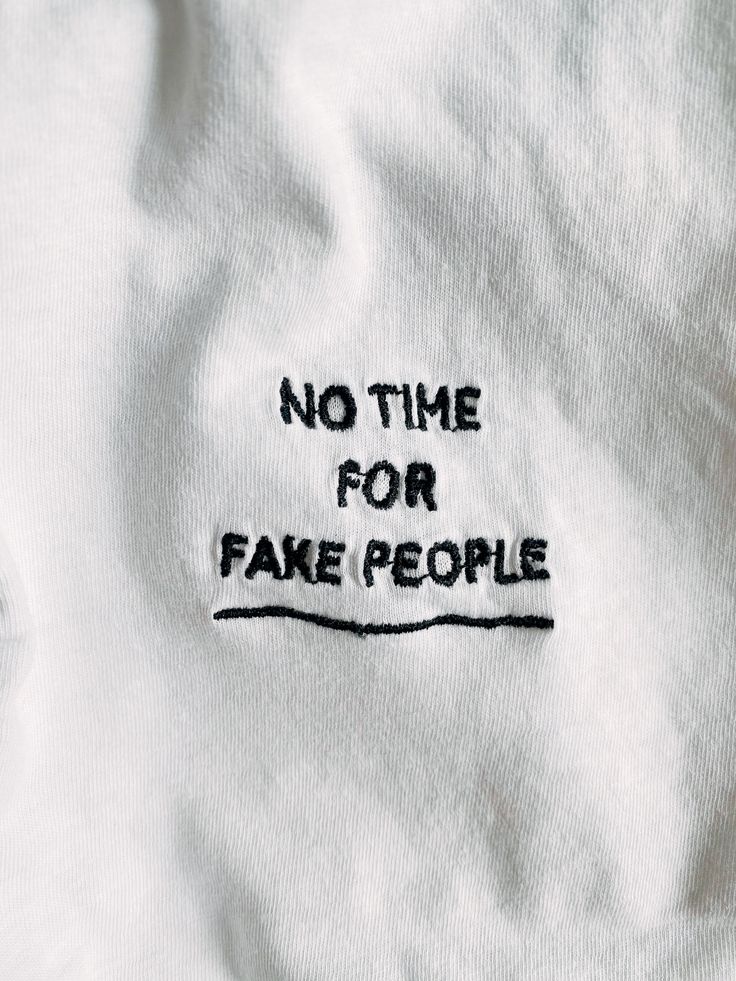 a t - shirt with the words no time for fake people embroidered on it's chest