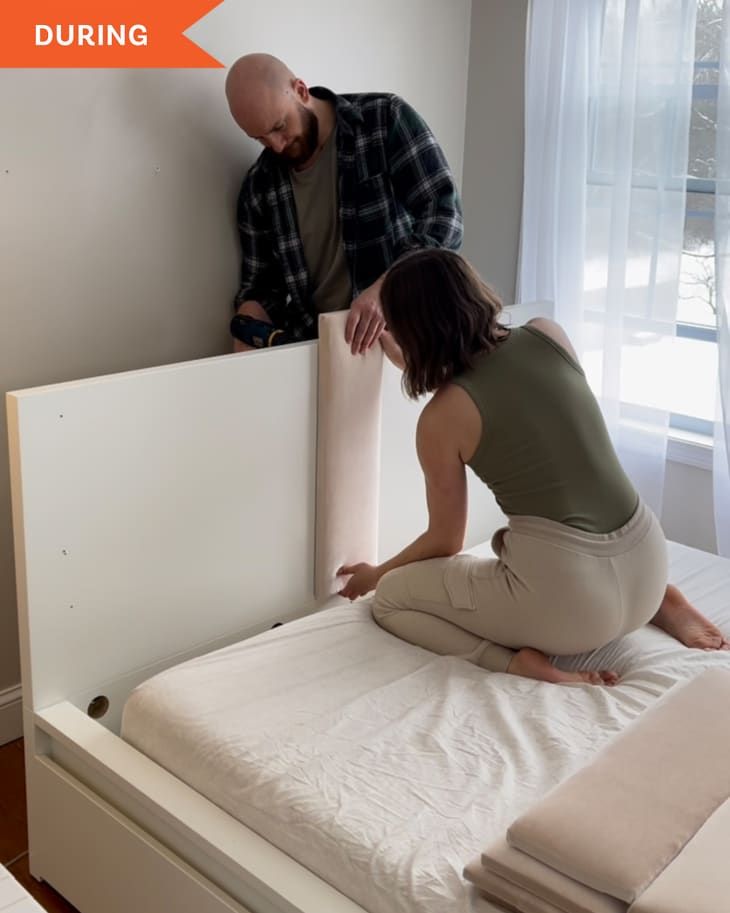 a man and woman are setting up the bed frame for their child's room