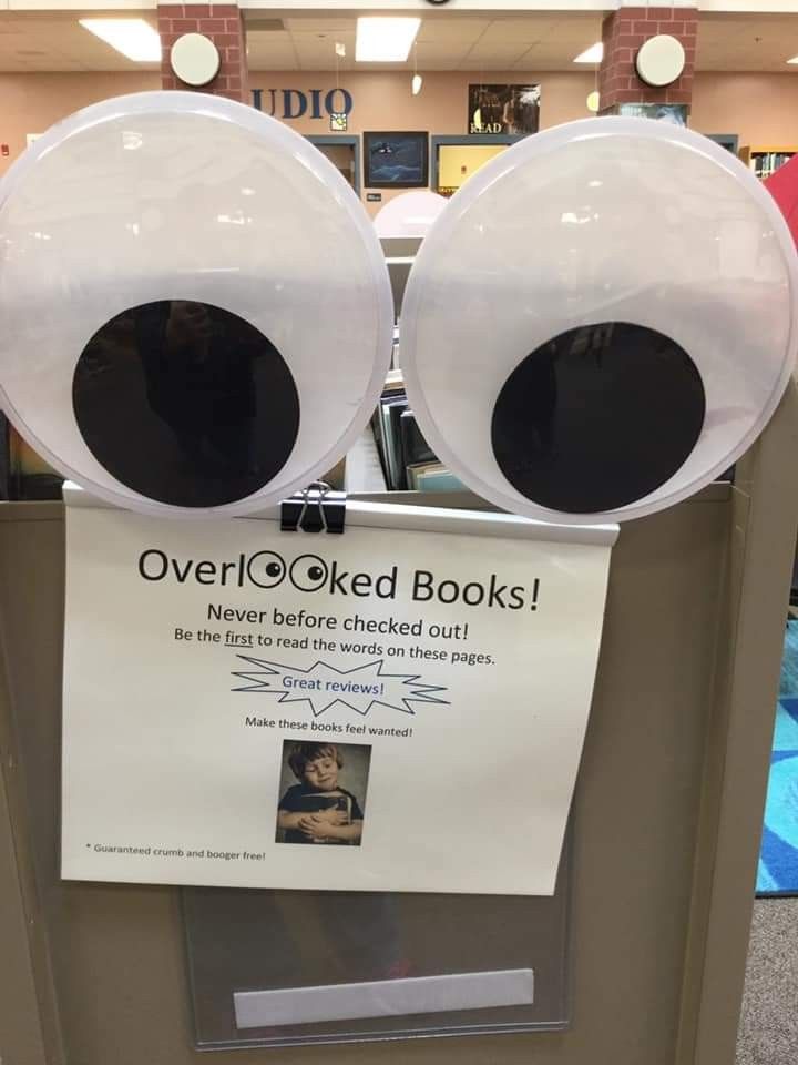 an eyeball display in a store with the caption overclocked books