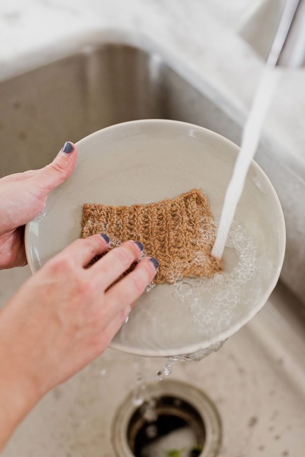 a person washing their hands in a sink