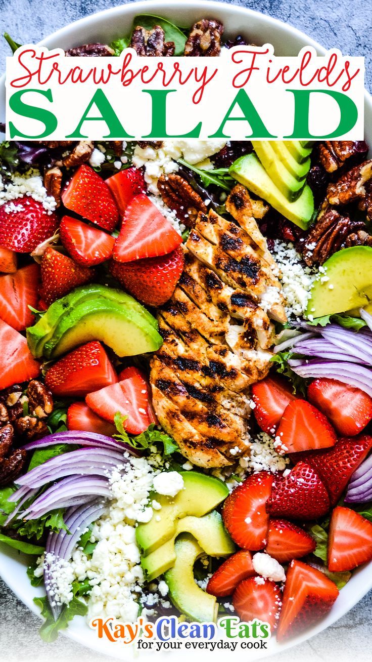 a salad with strawberries, avocado, and other fruits in it is featured on the cover of strawberry fields salad