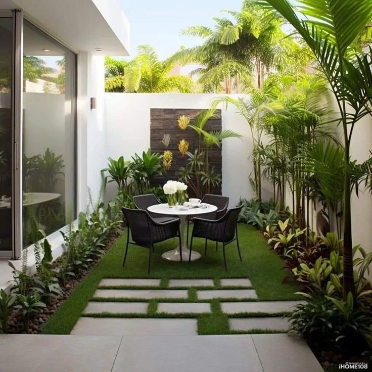 an outdoor dining area with grass and plants