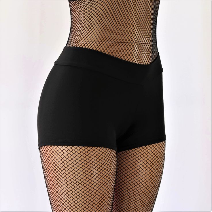 "These shorts feature a black tricot spandex, a 2\" thick waistband, and a full coverage back. The fabric has a very nice 4-way stretch and is breathable to allow for all day wear. These are perfect for all activities such as dancing, workouts, yoga, and the beach. The shorts here are offered in mid rise (pictured) with the option for a high waist (not pictured). STYLE OPTIONS Mid Rise (pictured) High Waist (not pictured) SIZING INFO ⭐Sizing Chart in Photos⭐ If you need help with sizing, send me Fitted Bottoms With Built-in Shorts For Workout, Basic Stretch Bottoms With Built-in Shorts, Fitted Elastane Skort With Built-in Shorts, High Stretch Solid Color Dancewear Tights, High Stretch Athletic Shorts With Built-in Shorts, Black Skort With Built-in Shorts, Solid Color Fitted Dancewear Hosiery, High Stretch Solid Nylon Shorts, Black Stretch Bottoms With Built-in Shorts