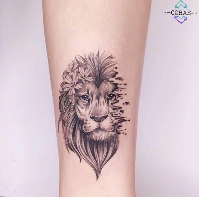 a black and white tattoo of a lion with flowers on its head