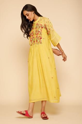 Yellow dress with floral embroidery around the neckline and mandarin collar. Comes with inner slip.
Component: 2
Embroidered
Neckline: Mandarin Collar
Sleeve Length: Three Quarter
Fabric: Chanderi Cotton
Color: Yellow
Front button placket - Aza Fashions Festive Summer Kurta With Embroidered Hem, Festive Yellow Dresses With Floral Embroidery, Yellow Embroidered Straight Kurta Dress, Traditional Straight Kurta Dress With Embroidered Neckline, Summer Anarkali Embroidered Dress Straight Kurta, Summer Festive Dress With Embroidered Border, Yellow Straight Kurta Dress With Floral Embroidery, Embroidered Chikankari Straight Kurta Dress, Embroidered Neckline Kurta For Summer Festivals