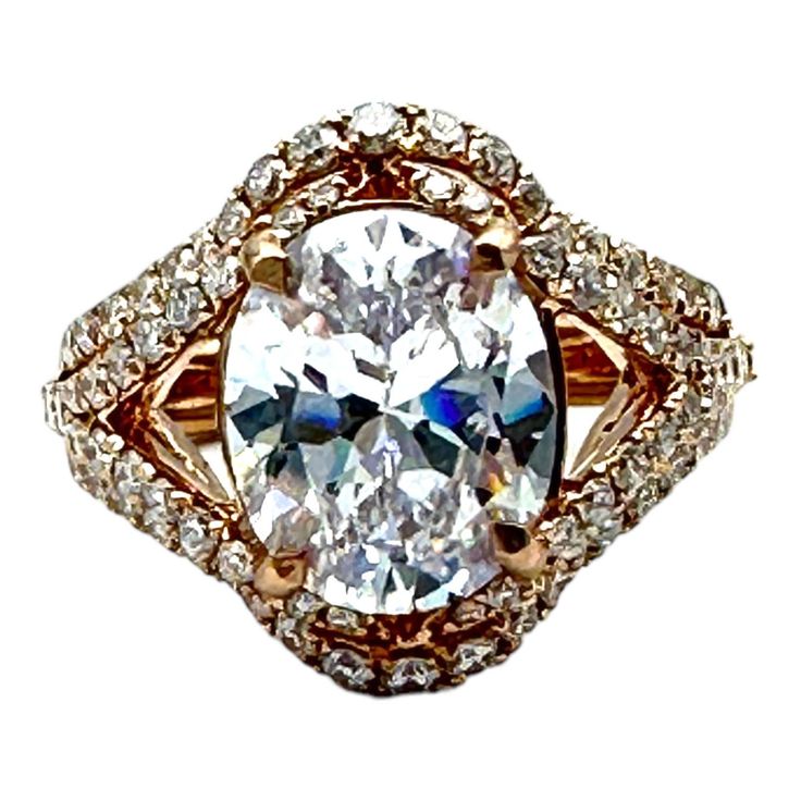 an oval shaped diamond ring with two rows of diamonds around it