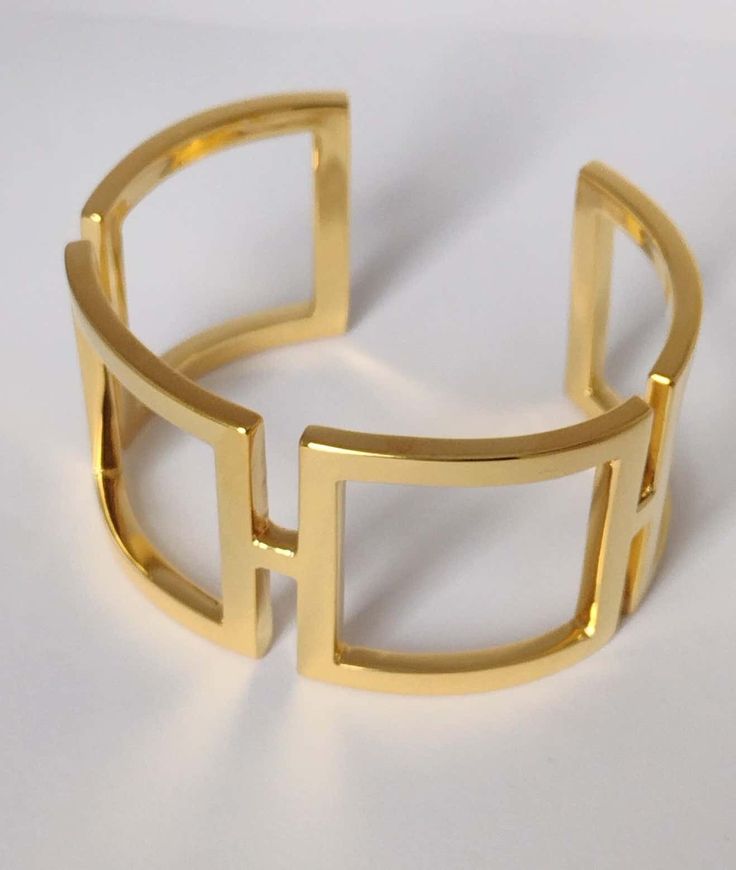 10 Karat Yellow Gold Rectangle Cuff Bracelet , 3 x 1.5 mm thick x mm 31 .25 wide. This is one of my early designs. I was using the simple rectangle in a curved state for the ultimate in expression of sculpture and a piece of jewelry. Clean, simple and elegant. This cuff will go from daytime to evening easily. Less is more. This design will last you your lifetime and easily passed down to you daughter. Made to order please allow 4 weeks delivery. $1,675 Modern Gold Bracelet With Polished Finish For Everyday Luxury, Gold Minimalist Bangle For Formal Occasions, Modern Gold Bangle For Formal Occasions, Modern Gold Formal Bangle, Minimalist Gold Bangle Bracelet For Formal Occasions, Chic Yellow Gold Bangle For Formal Occasions, Elegant Polished Finish Cuff Bracelet For Everyday, Elegant Polished Cuff Bracelet For Everyday Wear, Modern 14k Gold Bangle Bracelet