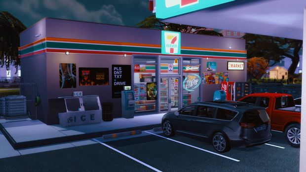 a gas station at night with cars parked in the lot