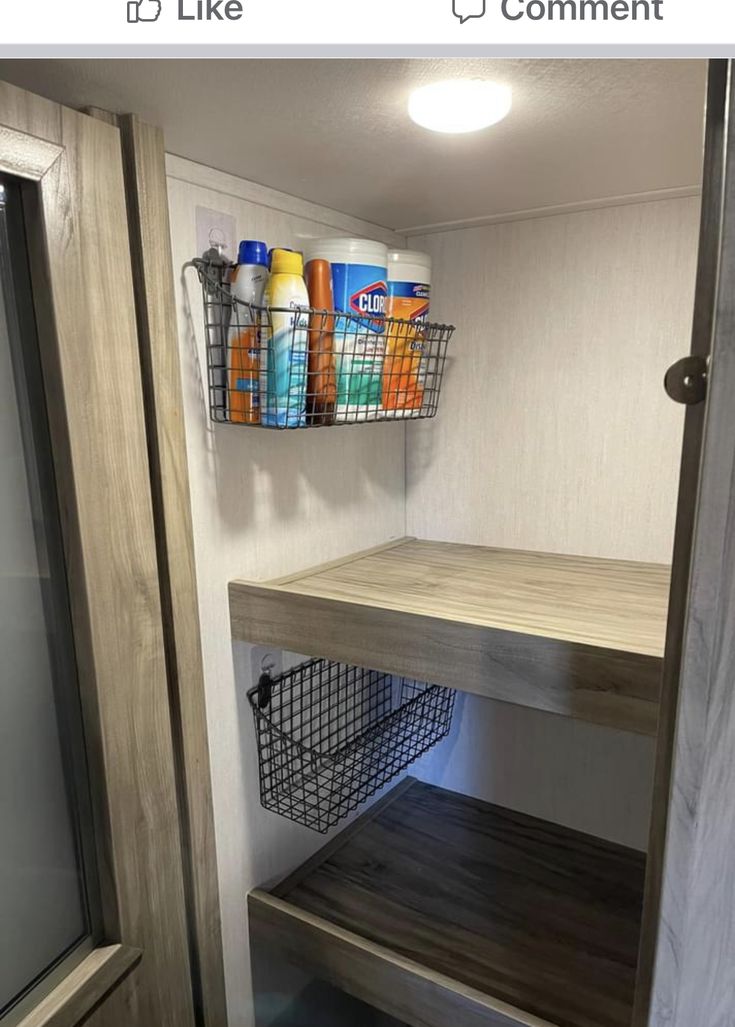 the inside of a mobile home with shelves and baskets