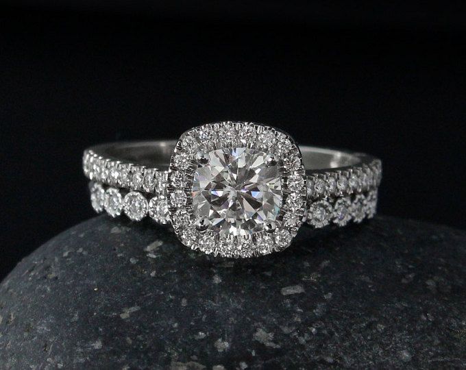 a diamond ring on top of a rock