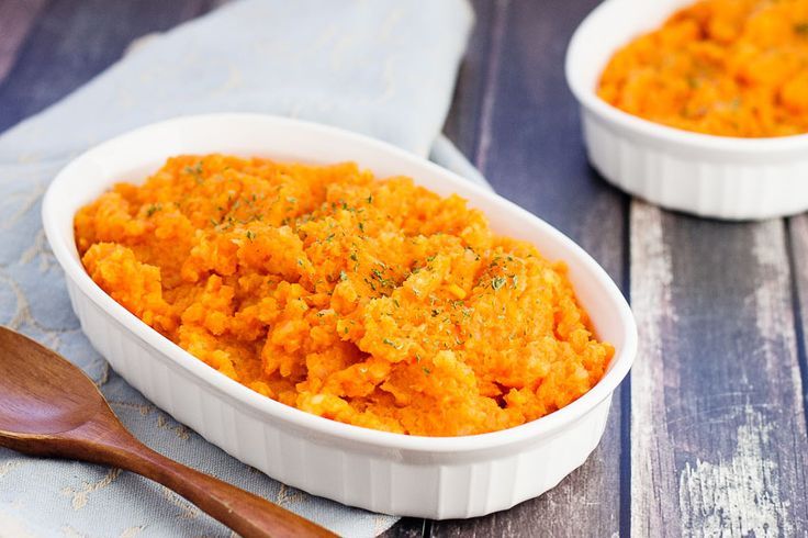 two white bowls filled with mashed sweet potatoes