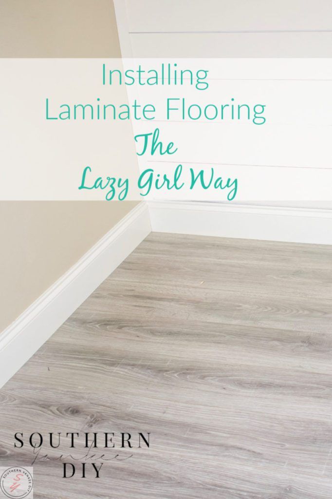 the floor is white and has green lettering on it that says installing laminate flooring the lazy girl way