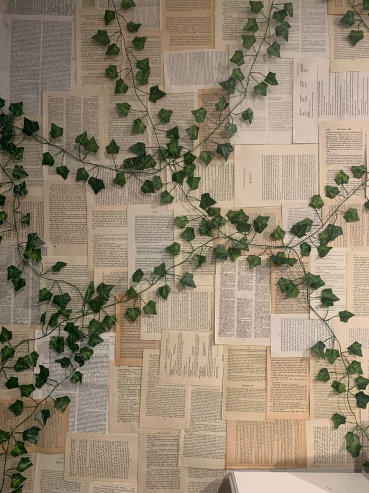 Book pages with vines Book Page Bedroom Wall Decor, Paper Wall Aesthetic, Book Page Wallpaper Bedroom, Book Page Diy Decor, Book Page Wallpaper Diy, Book Page Accent Wall, Hang Vines On Wall, Book Wall Bedroom, Book Page Collage Wall