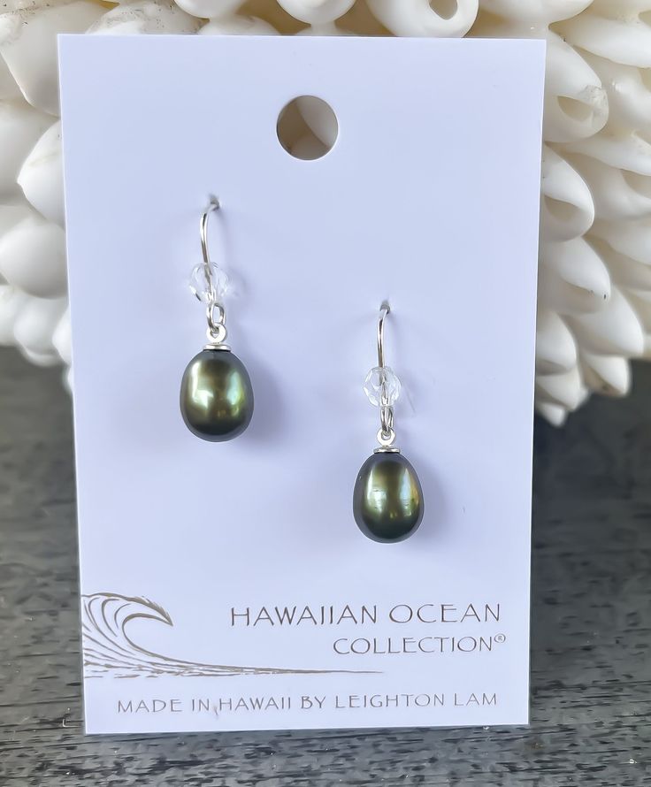 A classic freshwater pearl earring to accentuate your style. We match each pearl by hand, but just like you, each pearl is unique. Length: 0.6" Materials: 9mm Freshwater Pearl. Czech Fire Polish Bead. Sterling silver ear wires. Collection: Hawaiian Ocean Collection