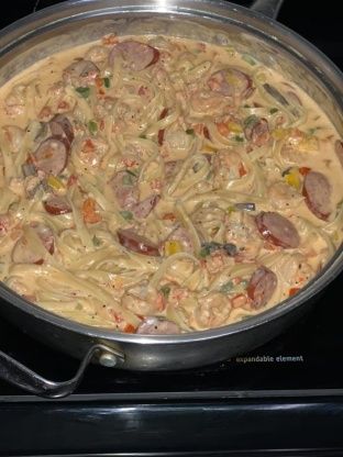 a pan filled with food sitting on top of a stove