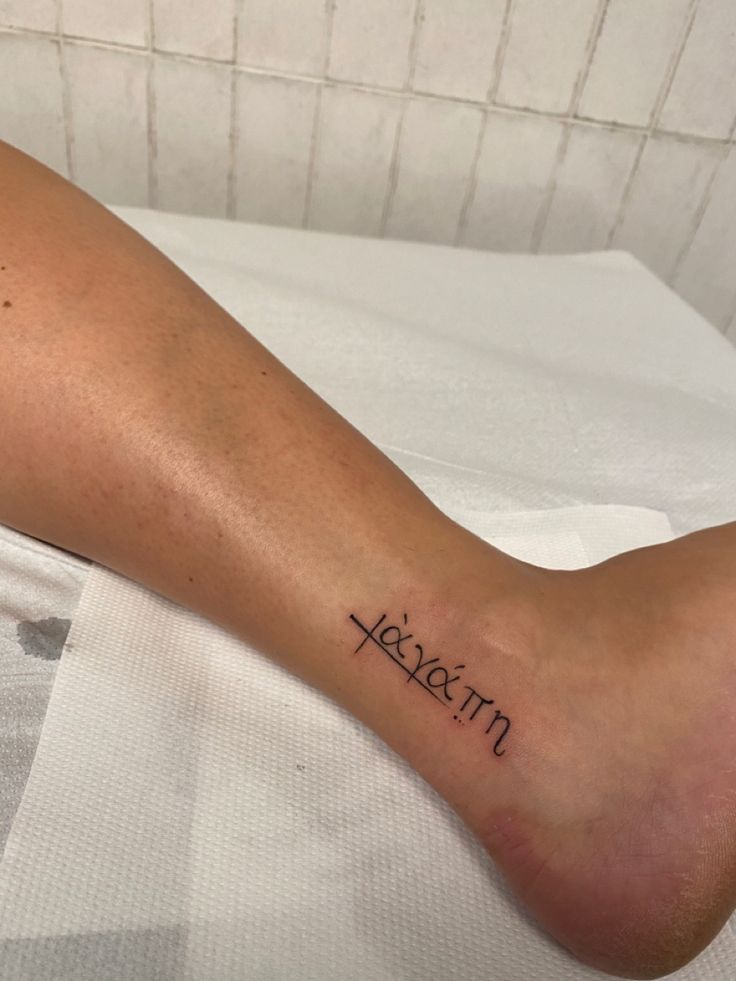 a person with a tattoo on their leg that reads, kassem'm