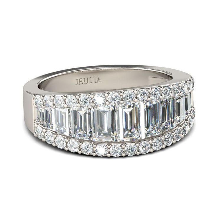 an emerald cut diamond ring set in 18k white gold with baguetts and diamonds