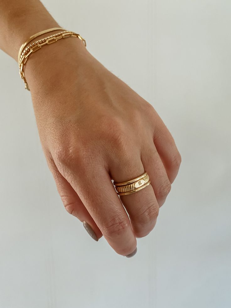 Our initial signet band is an everyday staple, personalized. The perfect way to showcase yourself or someone you love. Not to mention, they make the perfect custom gifts. Modeled with: 2 hammered stacking rings Dainty Initial Ring With Round Band For Everyday, Dainty Everyday Initial Ring With Round Band, Classic Everyday Stackable Signet Ring, Simple Yellow Gold Initial Ring For Everyday, Everyday Yellow Gold Initial Ring With Round Band, Everyday 14k Rose Gold Initial Ring, Engraved Initial Ring For Everyday, Timeless Everyday Initial Ring, Gold Stackable Rings With Initials For Everyday