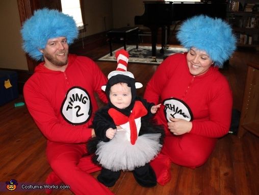 three people dressed up as dr seuss and cat in the hat with a baby