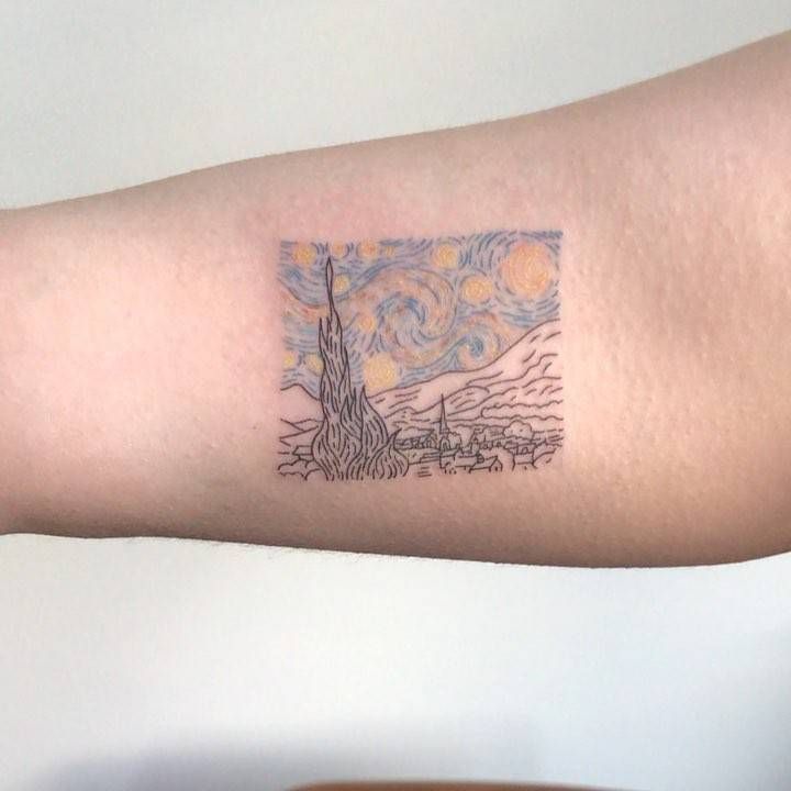 a person with a tattoo on their arm has a starry night sky behind them