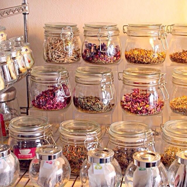 many jars filled with different types of spices