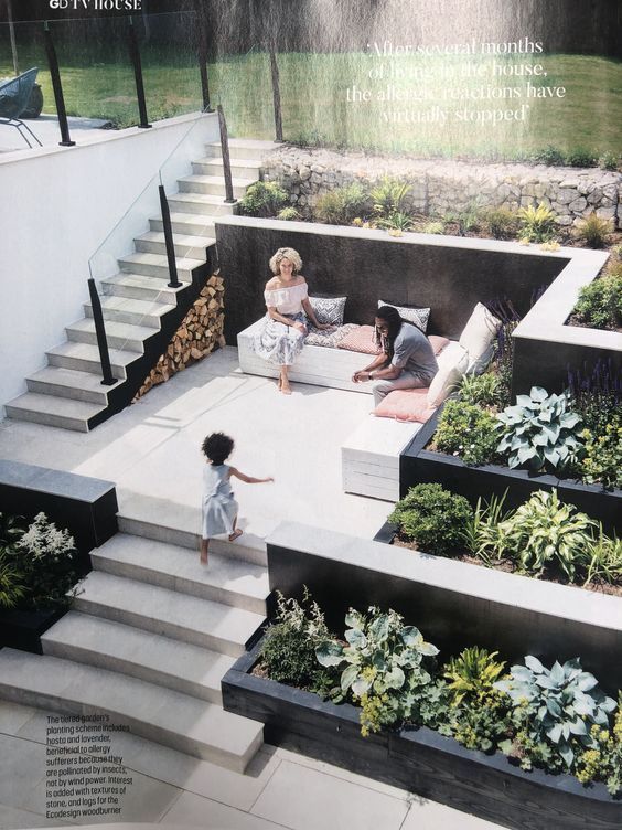 an advertisement with children playing on the steps in front of some planters and stairs