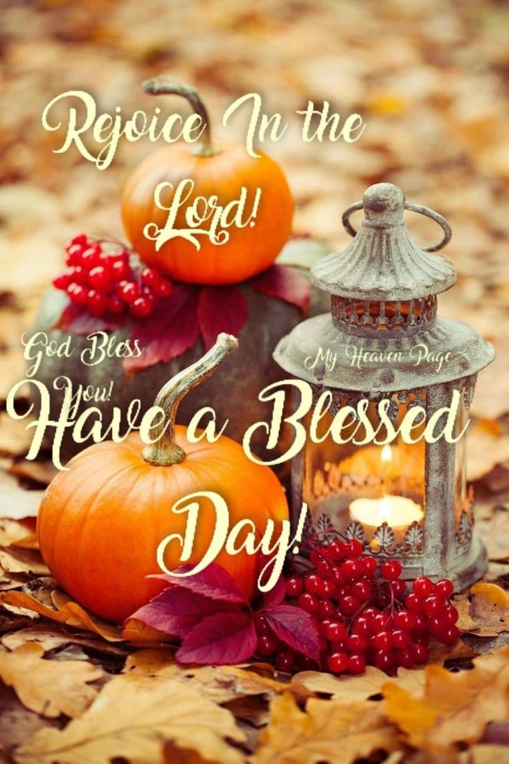 two pumpkins sitting on top of leaves next to a lantern with the words, rejoce in the lord and have a blessed day