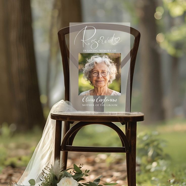 an old lady's wedding photo on a chair with flowers in the foreground