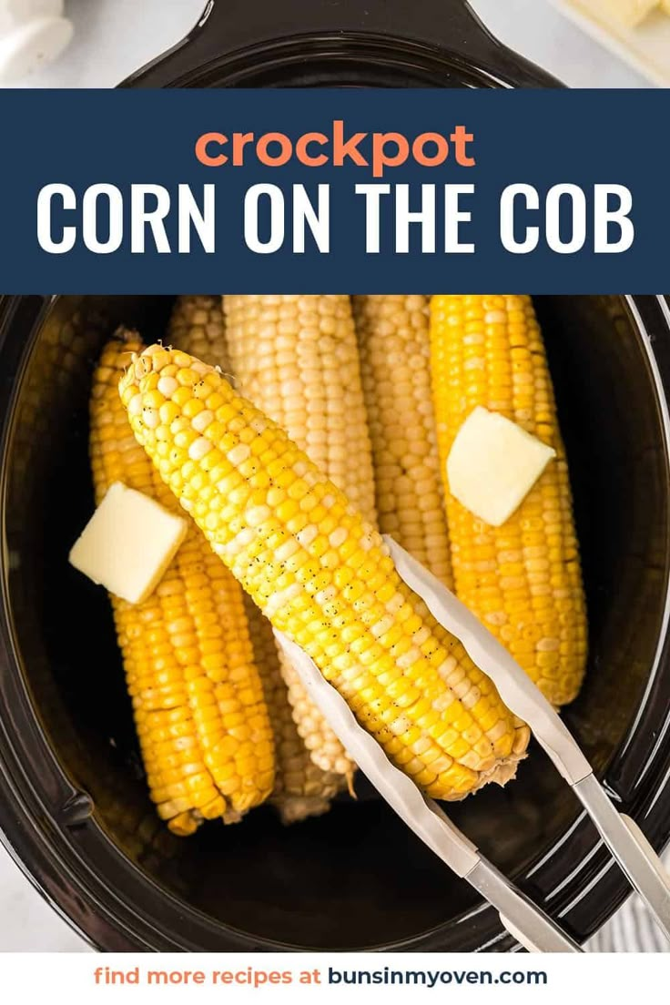 crockpot corn on the cob with butter in it and two forks sticking out