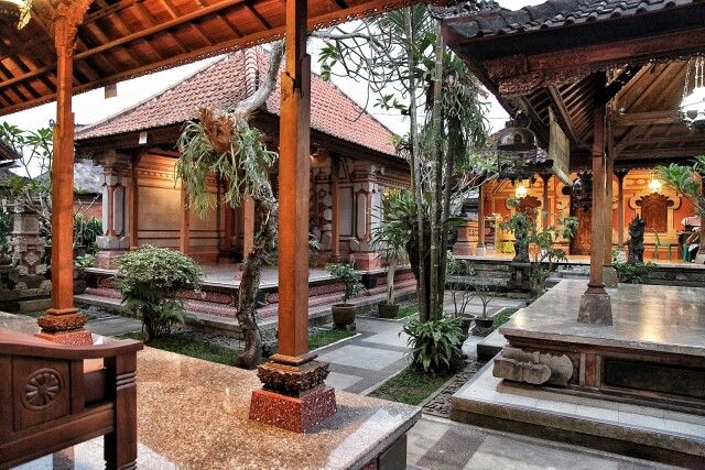 an outdoor area with wooden structures and plants