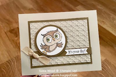 a hand holding up a card with an owl on it's front and bottom