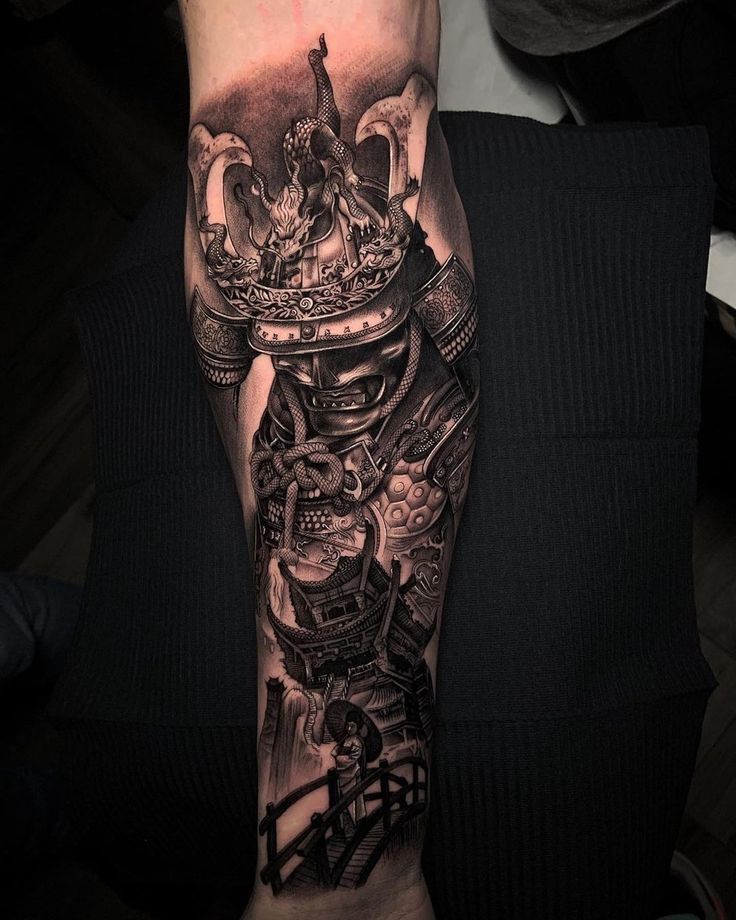 a man's arm with a black and grey tattoo design on it, including a crown