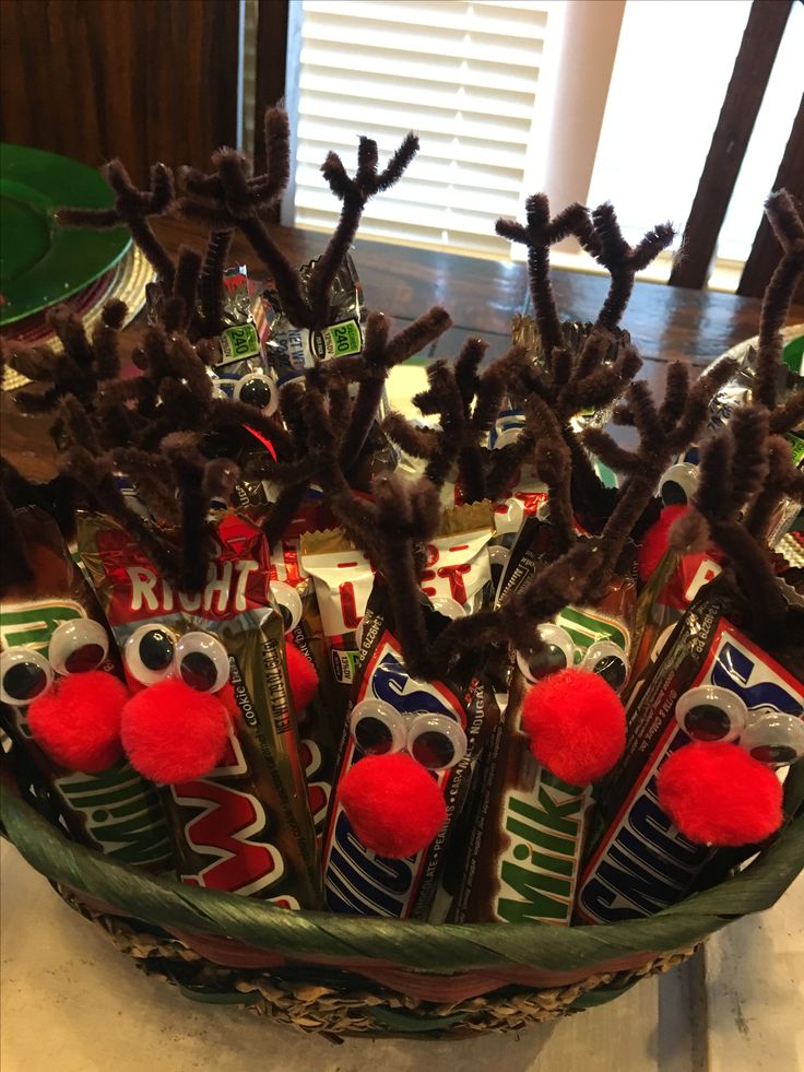 a bowl filled with chocolate candies and reindeer antlers on top of a table