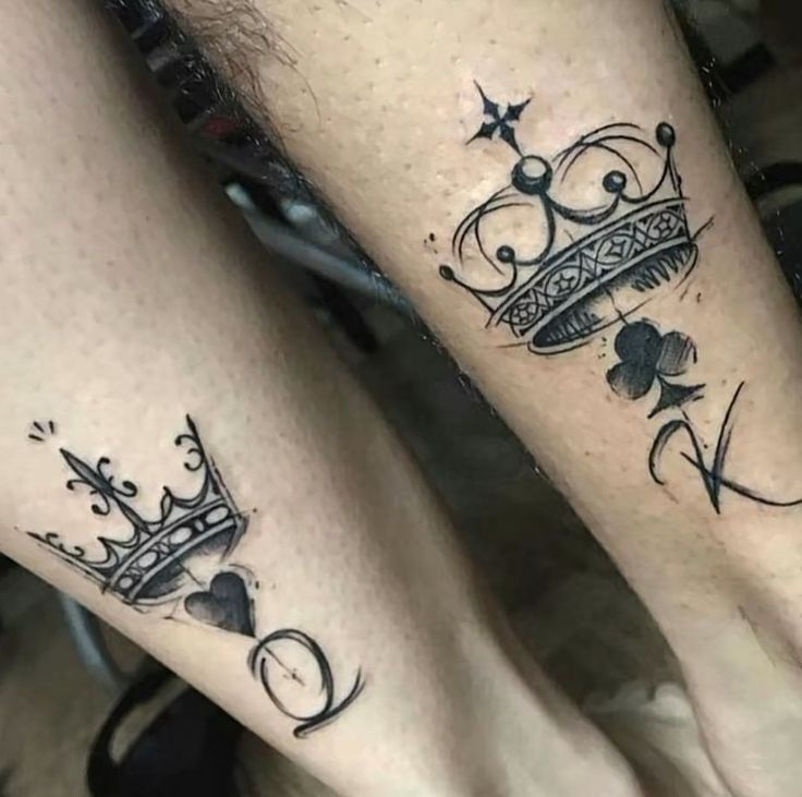 two people with tattoos on their legs and one is wearing a tiara, while the other has a shamrock