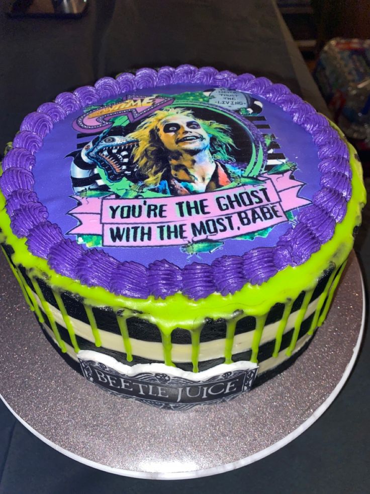 there is a cake that has been decorated with the words you're the ghost with the most bake