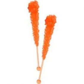 three orange lollipops sitting on top of each other