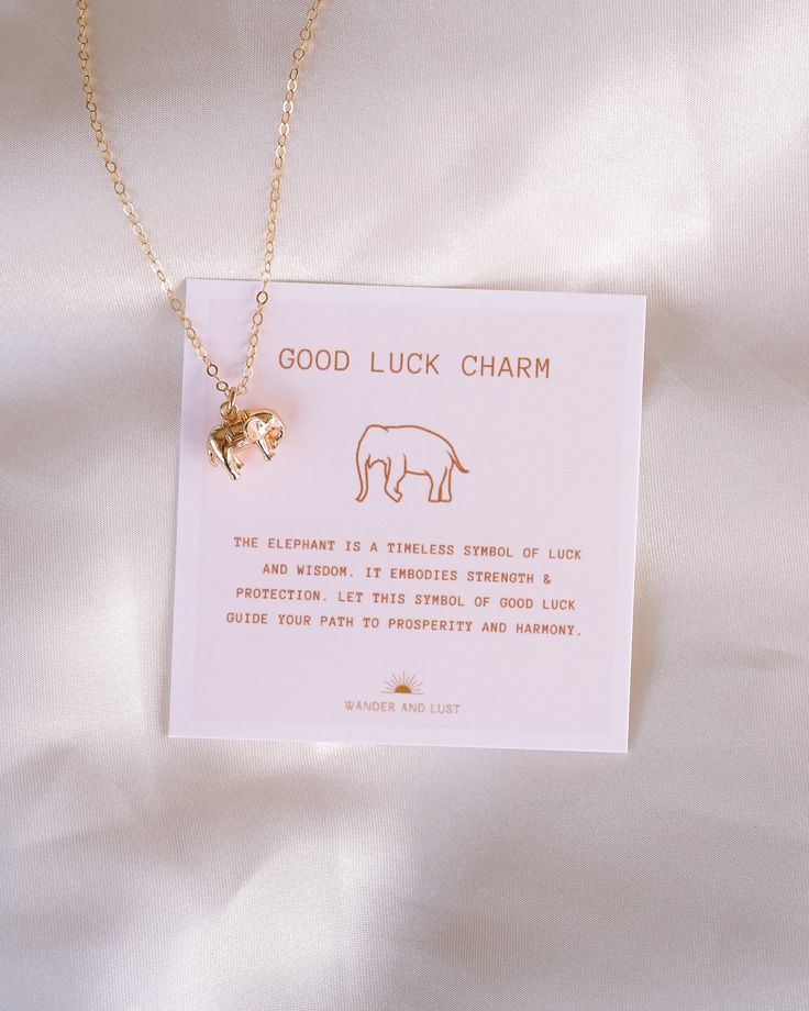 Be fearless and wild with the Elephant Luck Necklace! Empower yourself with good luck in style, with this dainty and unique necklace. Perfect for taking brave risks and going after your dreams! The elephant is a timeless symbol of luck and wisdom. It embodies strength & protection. Let this symbol of good luck guide your path to prosperity and harmony. NECKLACE FEATURES Chain: 14K Gold-filled Cable Chain Charm: 10mm x 12mm x 8mm Brass, 18K Gold-plated. Each necklace comes with the "Good Luck Cha Dainty Round Pendant Charm Necklace For Good Luck, Minimalist Good Luck Pendant Necklaces, Spiritual Good Luck Charm Necklaces Adjustable, Symbolic Personalized Good Luck Necklaces, Good Luck Symbolic Necklace With Personalized Details, Adjustable Nickel-free Necklace For Good Luck, Minimalist Personalized Good Luck Necklace, Ethereal Core, Elephant Necklace Gold