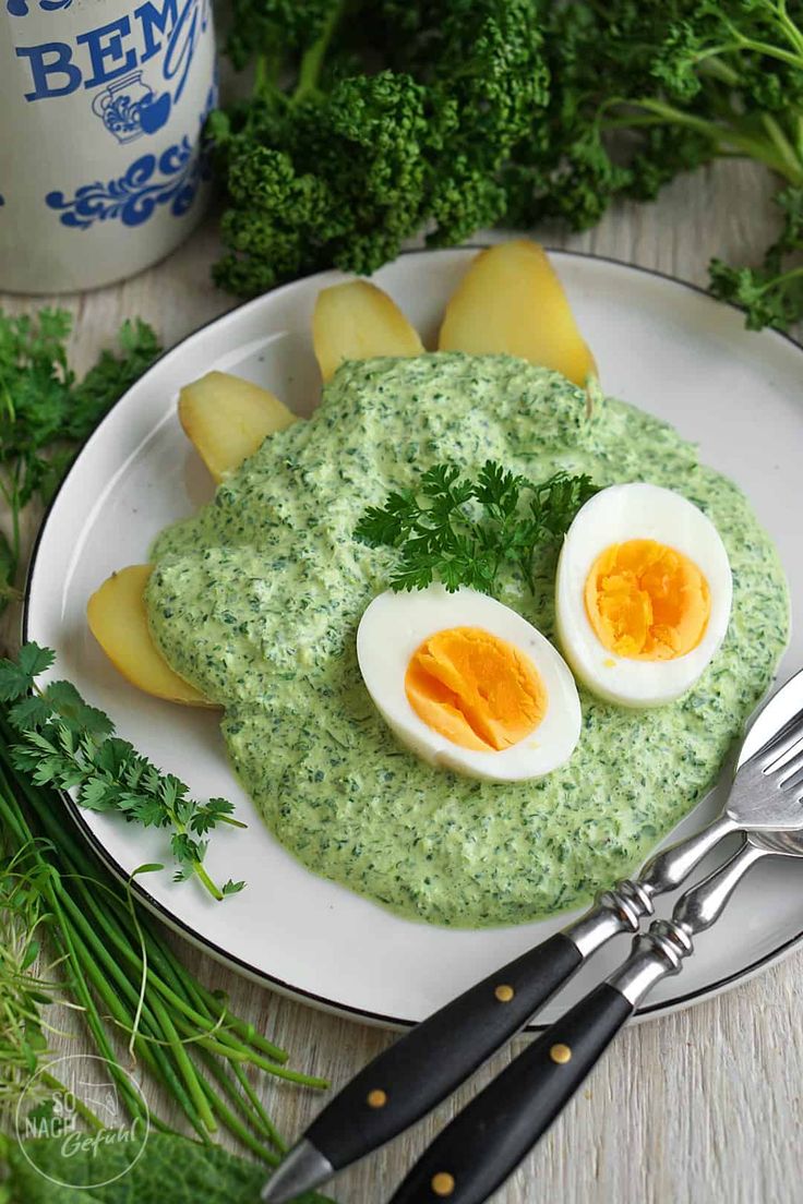 an egg is cut in half on a plate with broccoli next to it